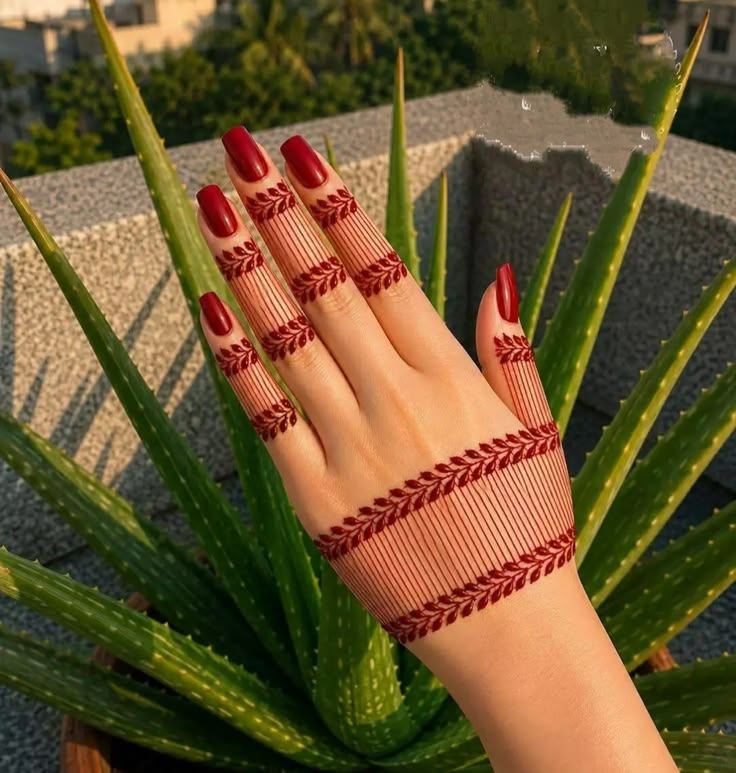Striped wrist band with leafy vines and finger bands